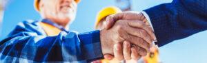 A licensed structural engineer shaking hands with a business owner in Hallandale Beach